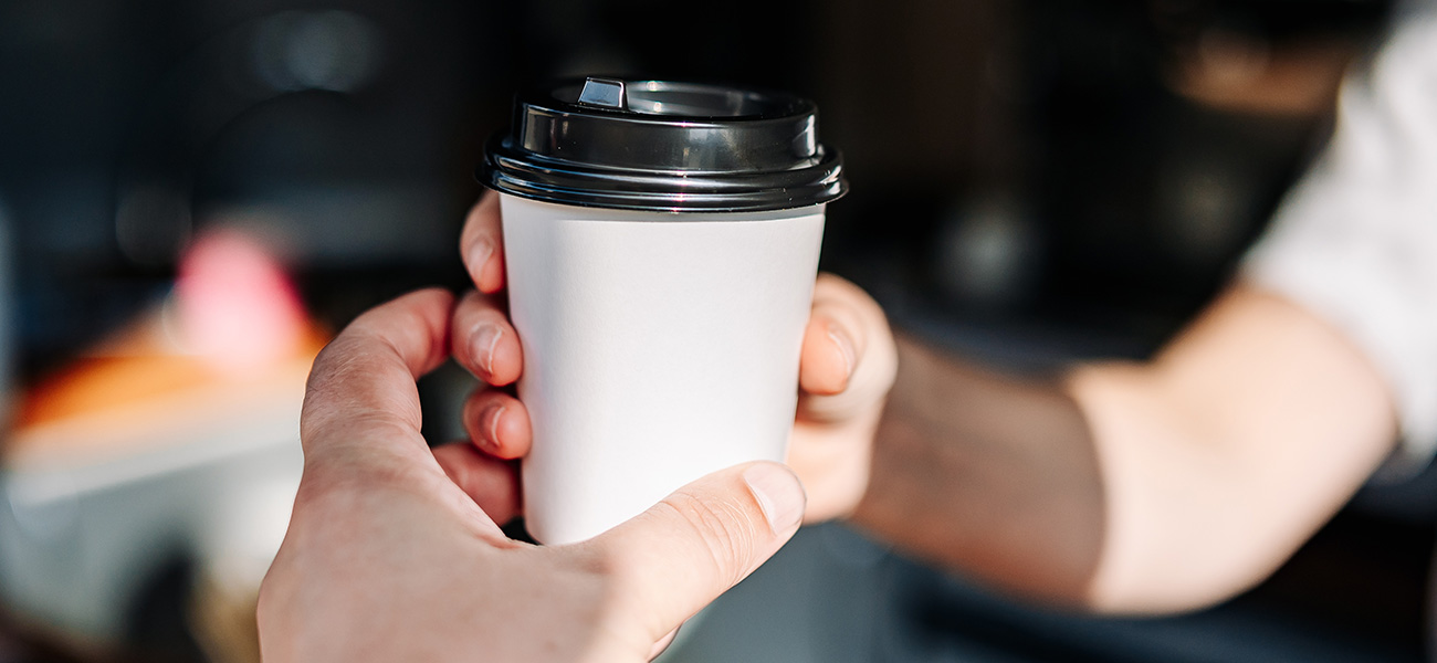 Person grabbing a coffee.
