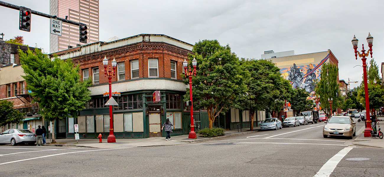 Street corner in Portland with mural in the background.