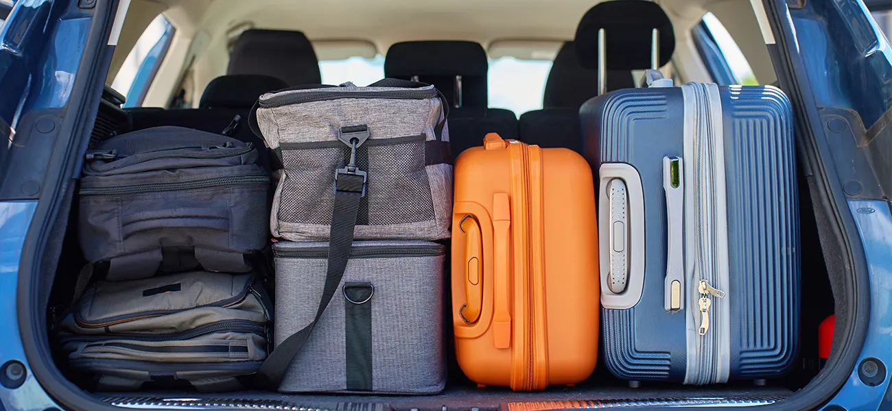 Suitcases in a car trunk.